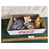 Cream and sugar and salt and pepper shakers