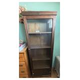 Curio cabinet with sliding door at the bottom