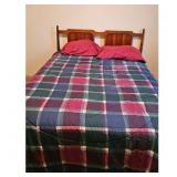 Bed w/ Plaid Comforter with Wooden Headboard and R