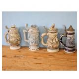 Set of 4 Vintage German Beer Steins with Relief Sc