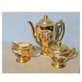 Vintage Gold Porcelain Tea Set with Scenic Design