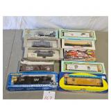 Assorted HO Scale Model Train Cars and Locomotive