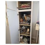 CONTENTS OF WHITE CUPBOARD BESIDE REFRIGERATOR
