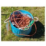 Lot of Orange and Green Extension Cords in Blue Bu