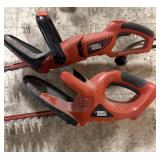 Two Black & Decker Hedge Trimmers one 24v battery
