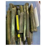 Chisel bits with hole punches