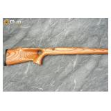 One laminate wood rifle stock. Very Good Condition