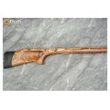 One laminate wood rifle stock. Very Good Condition