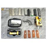Magazines and gunsmithing tools.This assortment in
