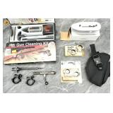 Assorted gun parts and maintenance accessories. Ve
