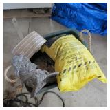 2 BAGS OF ROCK SALT, AND 2 HOSE REELS