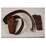 TWO LEATHER HOLSTERS, ONE W/ BELT