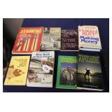 STACK OF OUTDOORSMAN BOOKS