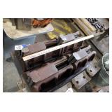 FOUR MACHINING JAWS (ONE IS BENT)