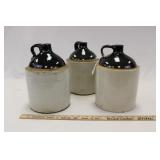 THREE TWO-TONE STONEWARE JUGS