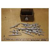 BOX OF ALUMINUM BOAT CLEATS