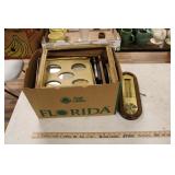 BOX OF PICTURE FRAMES, ARTWORK  AND THERMOMETER