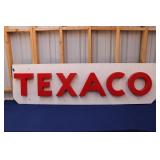 PLASTIC BLOCK LETTER TEXACO SIGN ON WOODEN BOARD