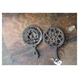 TWO WILTON CAST IRON TRIVETS