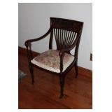 CARVED MAHOGANY CHAIR W/ CASTERS