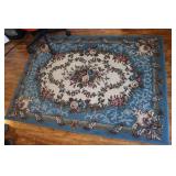 AREA RUG - 3' 10' X 5' 5'
