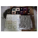 STACK OF BLANKETS AND QUILTS