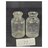 Two Small Clear Glass Medicine Bottles