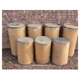Seven Heavy Cardboard Lidded Shipping Drums