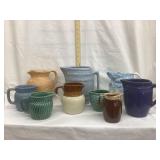 (9) Stoneware Pitchers, Various Sizes