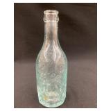 L. Stoll, Des Moines, Iowa Embossed Bottle, Rim &