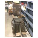 antique wheelchair, caned seat, good condition