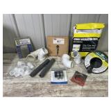 Box of PVC Pipe, Cork Tape, Drum Auger, and