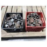 Metal Pipe Fittings in Two Milk Crates