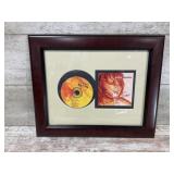 Framed display of the album Burn by country m