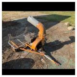 Orange portable gasoline engine yard debris vacuum