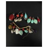 Assorted gemstone and metal charms, including