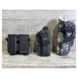 2 pistol holsters and a magazine holster