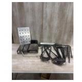 Assorted metal parts brackets bars and a plate