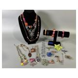 Assortment Of Necklaces, Bracelets, And Brooches