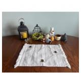 Lantern, figurines, table runner with bee patterns