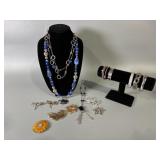 Necklaces, Bracelets, And Brooches