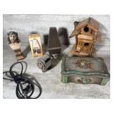 Metronomes, birdhouse, pencil sharpener