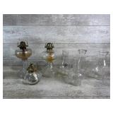 Three Oil Lamps and Four Glass Hurricanes