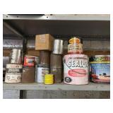 1-Shelf Full Of Paint And Caulk
