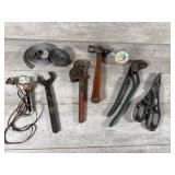 Channel locks, pipe wrench, hammer