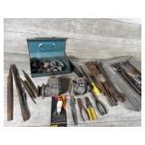 Old motors, pipe wrench, pliers