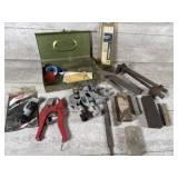 Tube cutter, files, clamps, rubbing stones