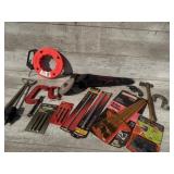 Hand saw, steel fish tape, drill bits