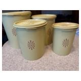 Yellow Tupperware canisters