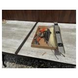Level, hand tools, and pry bar